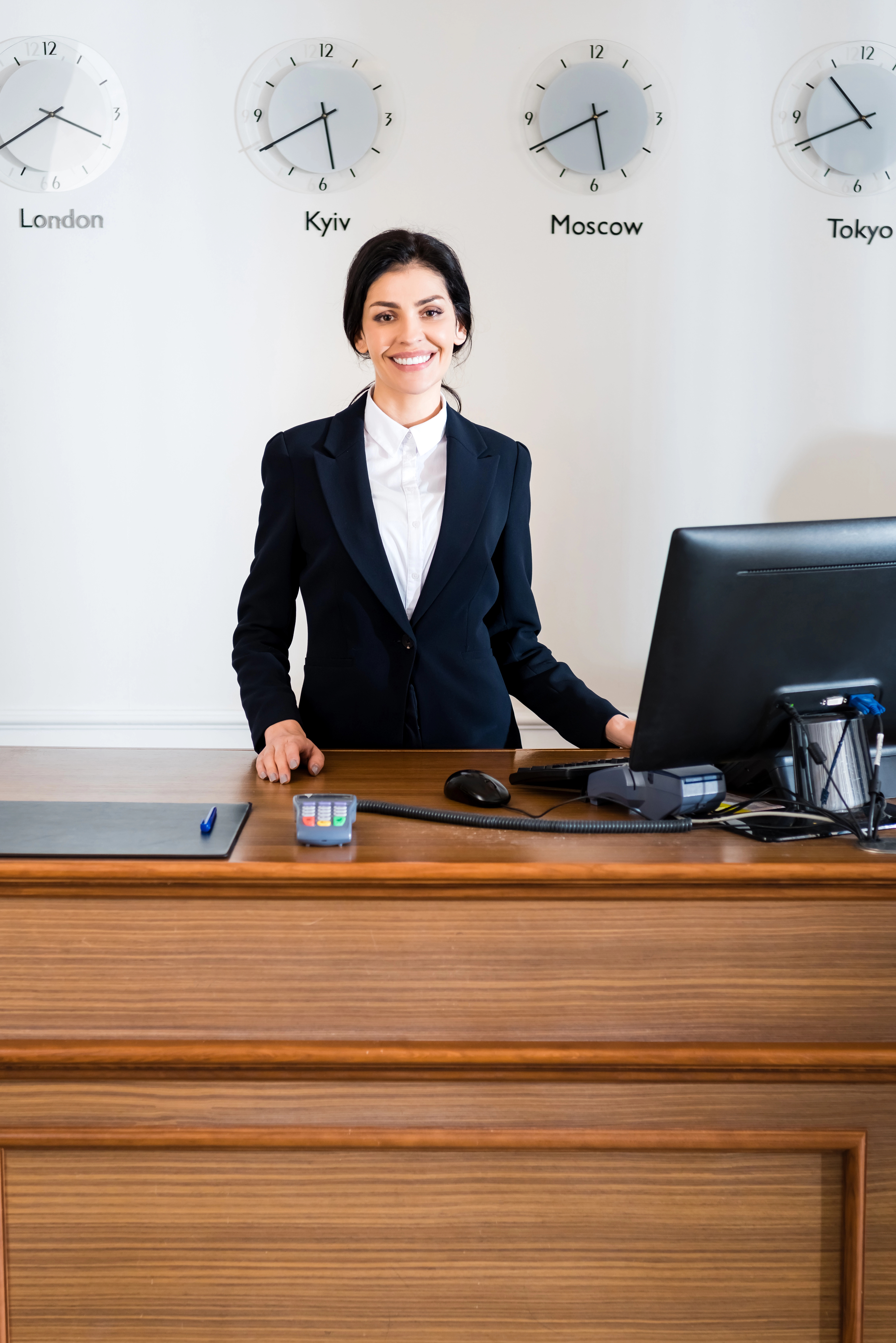 Woman standing at reception desk